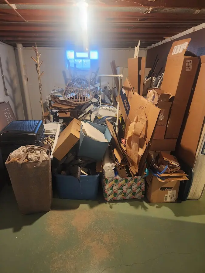 Roll-off dumpster container at job site for 8 Yard Dumpster Rental in Warren