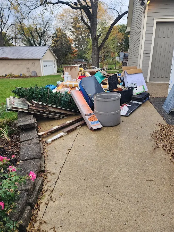 Dumpster being loaded with debris for 3 Yard Dumpster Rental in Warren